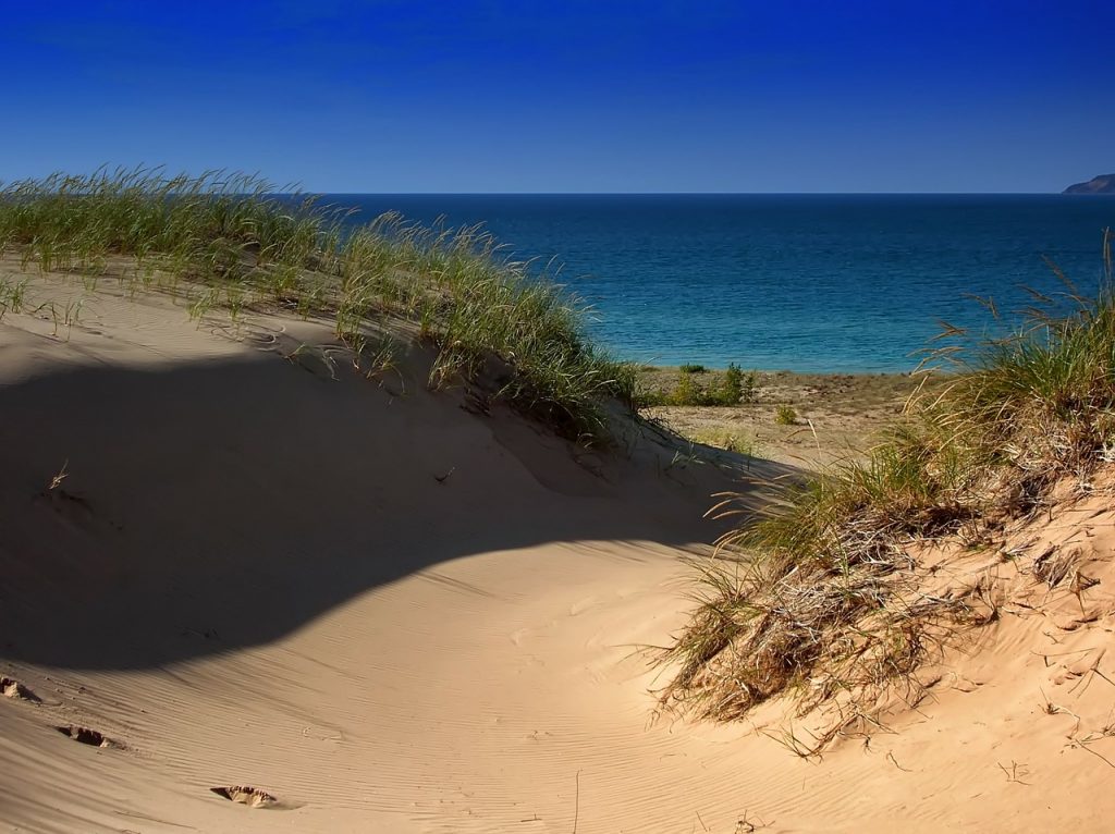 Enjoying summer on the sand dunes of breathtaking Lake Michigan is worth enduring the blustery winters here.